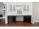Bright office space with custom built-in cabinets, counter space, and large windows at 10749 Kingsview Dr, Davidson, NC 28036