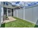 Cozy screened porch leads to fenced backyard with turf at 110 Synandra Dr # B, Mooresville, NC 28117