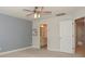 Bedroom with ceiling fan, an en-suite bathroom and good natural light at 110 Synandra Dr # B, Mooresville, NC 28117
