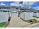 Charming townhome with attached garage and well-maintained landscaping and white fence at 110 Synandra Dr # B, Mooresville, NC 28117