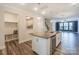 Kitchen island with granite countertops and stainless steel dishwasher, plus a built-in mudroom area at 110 Synandra Dr # B, Mooresville, NC 28117