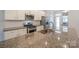 Close-up of kitchen with granite countertops, stainless steel appliances, and subway tile at 110 Synandra Dr # B, Mooresville, NC 28117