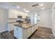 Bright kitchen with granite countertops, stainless steel appliances, and island sink at 110 Synandra Dr # B, Mooresville, NC 28117