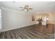 Spacious living room with hardwood floors and modern ceiling fan at 110 Synandra Dr # B, Mooresville, NC 28117
