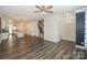 Open-concept living room flowing into the kitchen with hardwood floors at 110 Synandra Dr # B, Mooresville, NC 28117