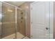 Modern bathroom shower with tiled walls, glass door and convenient fixtures at 110 Synandra Dr # B, Mooresville, NC 28117