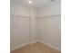 Walk-in closet featuring carpet and built-in shelving with ample space for organization and storage at 110 Synandra Dr # B, Mooresville, NC 28117