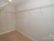 Walk-in closet features carpeted flooring and wire shelving for organized storage at 110 Synandra Dr # B, Mooresville, NC 28117