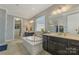 Primary bathroom with double vanities and a soaking tub at 11333 Preservation Ln, Charlotte, NC 28278