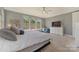 Bedroom with carpet, large windows, and a white dresser at 11333 Preservation Ln, Charlotte, NC 28278