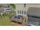 Elevated deck with modern outdoor seating and fire pit, ideal for gatherings and enjoying the backyard at 11333 Preservation Ln, Charlotte, NC 28278