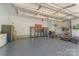Clean, well-organized garage with epoxy flooring, storage cabinets, and ample space at 11333 Preservation Ln, Charlotte, NC 28278