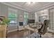 Bright home office with large windows, hardwood floors, and modern desk setup at 11333 Preservation Ln, Charlotte, NC 28278