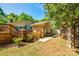 Brick home boasts a spacious backyard with a deck, wooden stairs, and patio area for outdoor enjoyment at 1154 Doby Ct, Fort Mill, SC 29715
