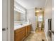 Bathroom featuring wood cabinets, linoleum floors, and a tub/shower combo at 1154 Doby Ct, Fort Mill, SC 29715