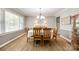 Classic dining room with elegant chandelier and ample natural light at 1154 Doby Ct, Fort Mill, SC 29715