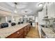 Spacious kitchen boasts granite countertops, stainless appliances, and adjacent open living space at 1154 Doby Ct, Fort Mill, SC 29715
