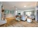 Open concept living area with hardwood floors, a fireplace, and lots of natural light at 1154 Doby Ct, Fort Mill, SC 29715