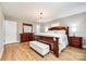 Main bedroom featuring beautiful hardwood floors, a chandelier and elegant furnishings at 1154 Doby Ct, Fort Mill, SC 29715