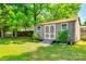 Charming outdoor shed with classic double doors and surrounded by manicured shrubbery at 1154 Doby Ct, Fort Mill, SC 29715