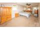 Spacious bedroom with wood furniture, a bed, and ample natural light at 125 Southwood Park, Mooresville, NC 28117