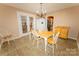 Bright breakfast nook with a table and chairs, and a view to the backyard at 125 Southwood Park, Mooresville, NC 28117