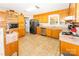 Kitchen with light wood cabinets, tile floors and stainless steel appliances at 125 Southwood Park, Mooresville, NC 28117