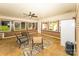Sunroom with tile floors, lots of windows, ceiling fan, and brick veneer half wall at 125 Southwood Park, Mooresville, NC 28117