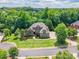 Expansive aerial view of a beautiful home nestled among lush trees and greenery on a well-manicured lot at 1260 Rittenhouse Ln, Rock Hill, SC 29732