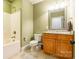 Bathroom features a shower over tub, mirror over the sink, and ceramic tile flooring at 1260 Rittenhouse Ln, Rock Hill, SC 29732