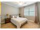 Bright bedroom showcasing a comfortable bed, neutral tones, and natural light from a window at 1260 Rittenhouse Ln, Rock Hill, SC 29732