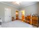 Bedroom with a wooden bed frame and dresser, complemented by neutral walls and ceiling fan at 1260 Rittenhouse Ln, Rock Hill, SC 29732