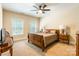 Bedroom with neutral walls, a ceiling fan, and two windows provide natural light at 1260 Rittenhouse Ln, Rock Hill, SC 29732