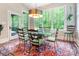 Bright dining room with glass table, large windows and chandelier at 1260 Rittenhouse Ln, Rock Hill, SC 29732