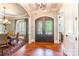 Inviting foyer with hardwood floors, decorative front door, and views into dining and living spaces at 1260 Rittenhouse Ln, Rock Hill, SC 29732