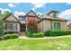 Beautiful two-story home with tan brick, manicured landscaping, and a welcoming front entrance at 1260 Rittenhouse Ln, Rock Hill, SC 29732