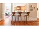 Kitchen bar counter with three seats, hardwood flooring and bright lighting at 1260 Rittenhouse Ln, Rock Hill, SC 29732