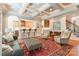 Inviting living room featuring a gray sofa, patterned ottoman, and an open layout to the kitchen at 1260 Rittenhouse Ln, Rock Hill, SC 29732