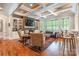 Bright living room with coffered ceilings, built-in shelves, and a stone fireplace for a cozy ambiance at 1260 Rittenhouse Ln, Rock Hill, SC 29732