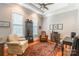 Cozy home office with hardwood floors, a cabinet for storage, and natural light from two windows at 1260 Rittenhouse Ln, Rock Hill, SC 29732