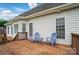Spacious back deck perfect for outdoor enjoyment and entertaining with charming seating at 129 Daniel Efird Dr, Mount Holly, NC 28120