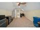 A bright bonus room with neutral carpet, a ceiling fan, and ample space for versatile use at 129 Daniel Efird Dr, Mount Holly, NC 28120