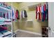 Walk-in closet with wire shelving provides ample storage space for clothing, shoes and accessories at 129 Daniel Efird Dr, Mount Holly, NC 28120