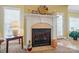 Elegant fireplace with white mantel, decorative accents, and tile surround at 129 Daniel Efird Dr, Mount Holly, NC 28120