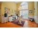 Well-lit home office with ample desk space, decor and lots of natural light at 129 Daniel Efird Dr, Mount Holly, NC 28120