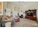 Spacious living area with high ceilings, seamlessly connecting to the dining area at 129 Daniel Efird Dr, Mount Holly, NC 28120