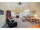Spacious living room with a cozy fireplace and lots of natural light at 129 Daniel Efird Dr, Mount Holly, NC 28120