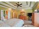 Spacious primary bedroom with en-suite bathroom, featuring a plush carpet, ceiling fan, and natural light at 129 Daniel Efird Dr, Mount Holly, NC 28120