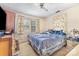 A simple bedroom offers a standard living space with natural light at 1308 Edgewood Rd, Charlotte, NC 28208