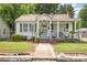 Charming single-story home with a welcoming front porch and well-maintained lawn at 1308 Edgewood Rd, Charlotte, NC 28208